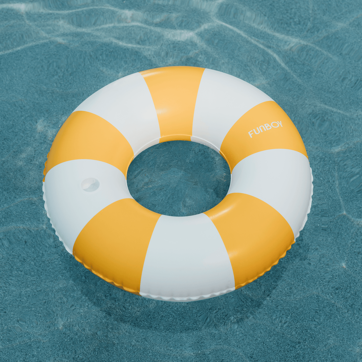 Mustard Orange Vintage Tube Float in a pool